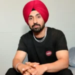 Khalistani outfit threatens Diljit Dosanjh for touching Amitabh Bachchan`s feet